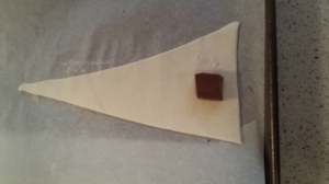 Step 1  Cut pastry triangle  Place piece of Chocolate 